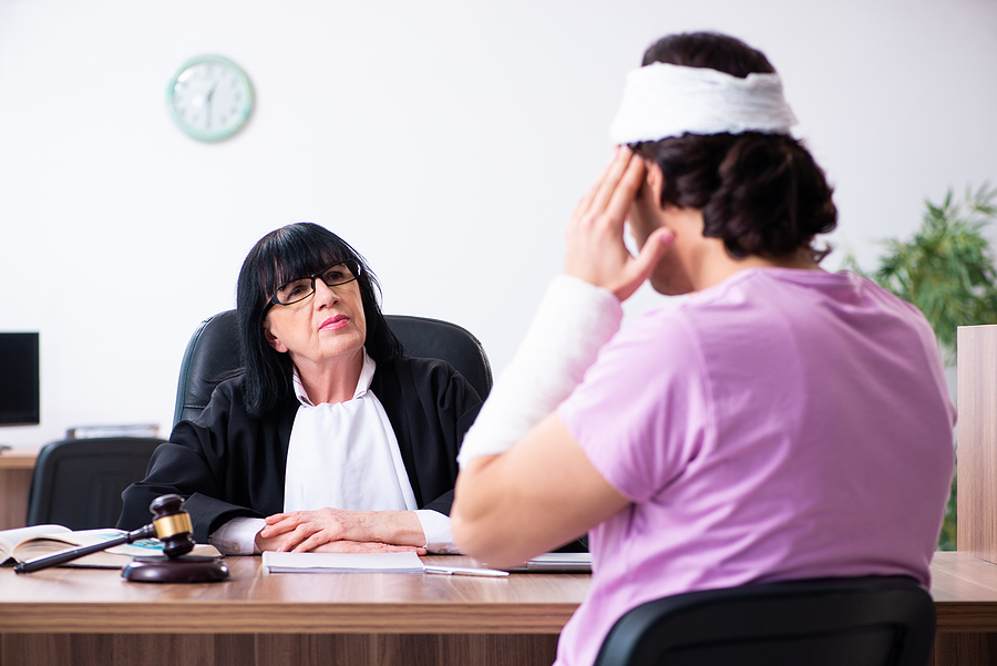 Disabled man consulting judge for damages litigation